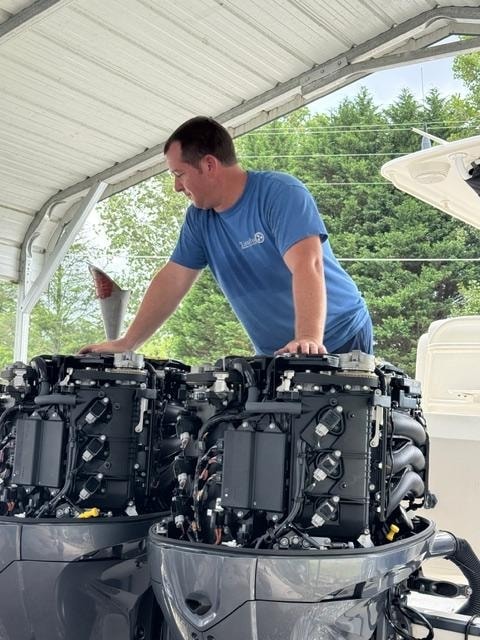 Technician servicing double Yamaha outboards
